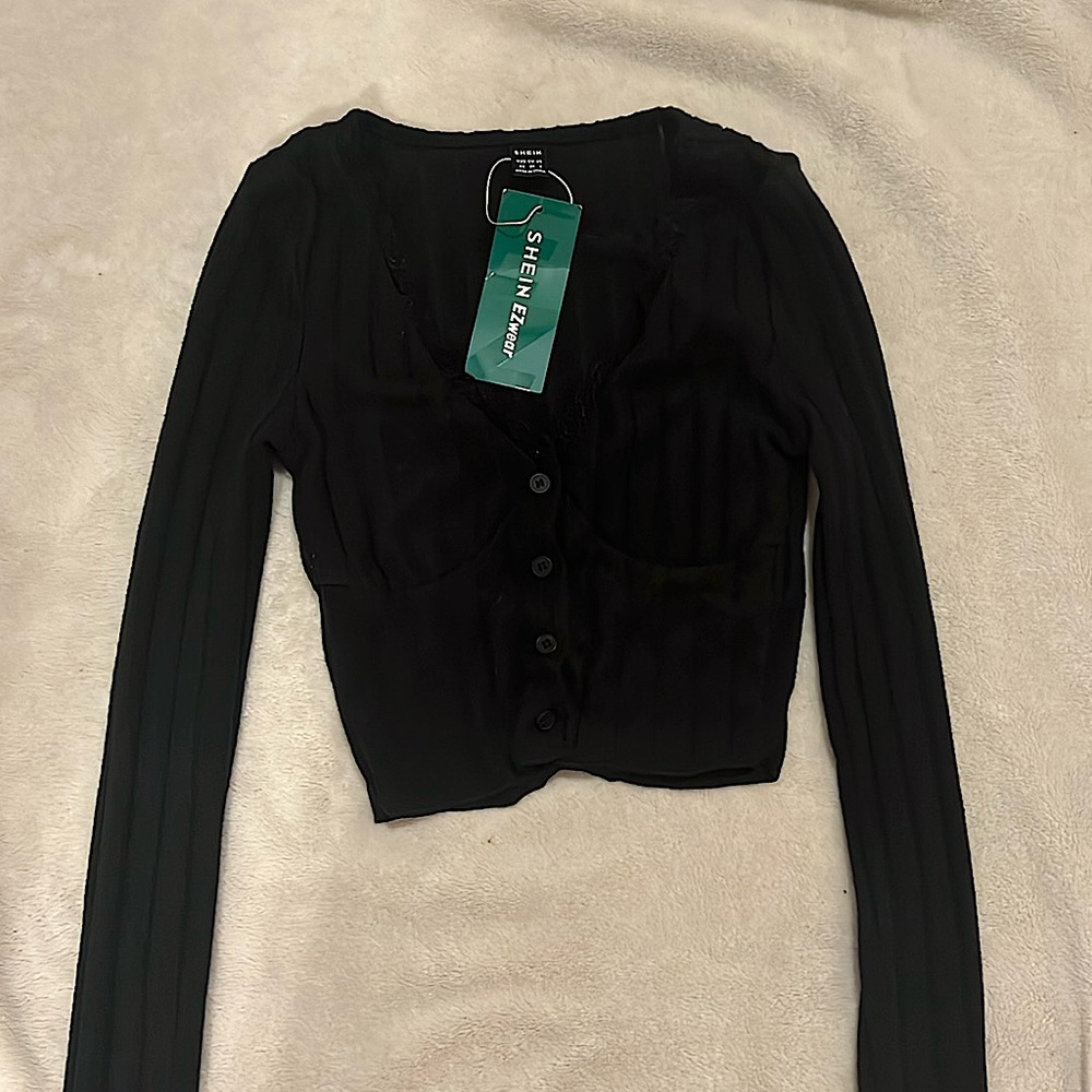 Black, cropped, long sleeved cardigan. Brand new, and never been warn.